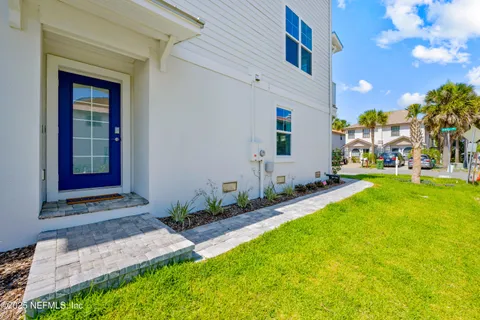 a view of an house with backyard porch and furniture