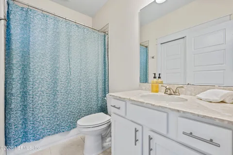 a front view of a house with swimming pool and sitting area