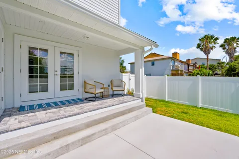a view of house with swimming pool outdoor seating