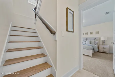 a kitchen with kitchen island granite countertop a sink a counter top space stainless steel appliances and cabinets