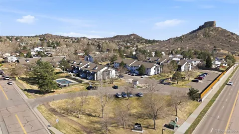 an aerial view of residential houses with outdoor space