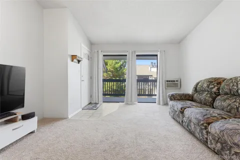 a living room with a couch and a flat screen tv