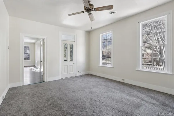 a view of an empty room with a window