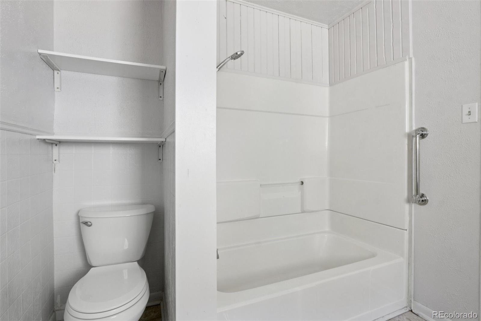 800 Main Street Georgetown, CO 80444 - Photo 15 of 21 a bathroom with a toilet and a shower