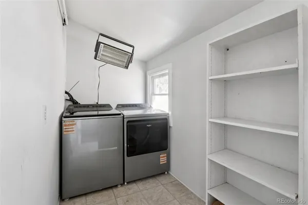 a utility room with washer and dryer