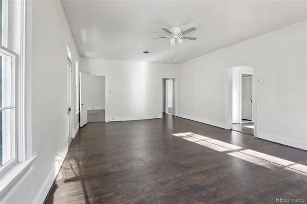 a view of a livingroom with wooden floor
