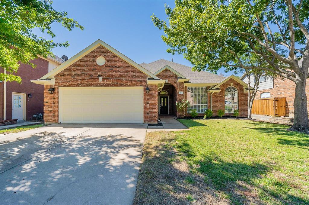 4204 Eagle Ridge Drive Arlington, TX 76016 - Photo 1 of 1 a front view of a house with a yard and garage