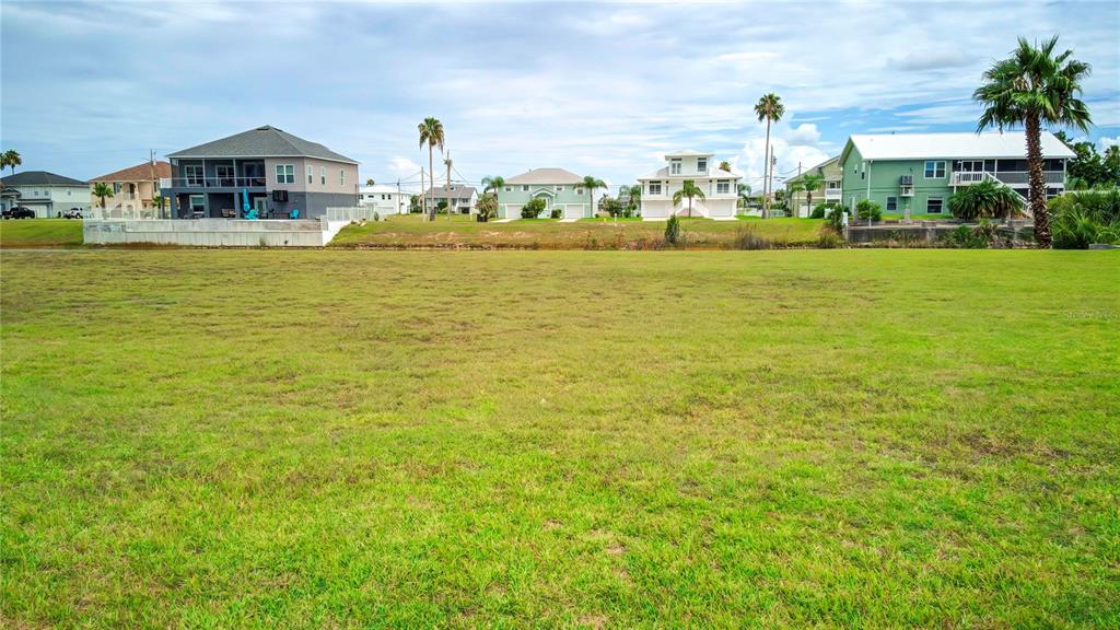 3487 Croaker Drive Hernando Beach, FL 34607 - Photo 12 of 23 a view of a white house with a ocean view