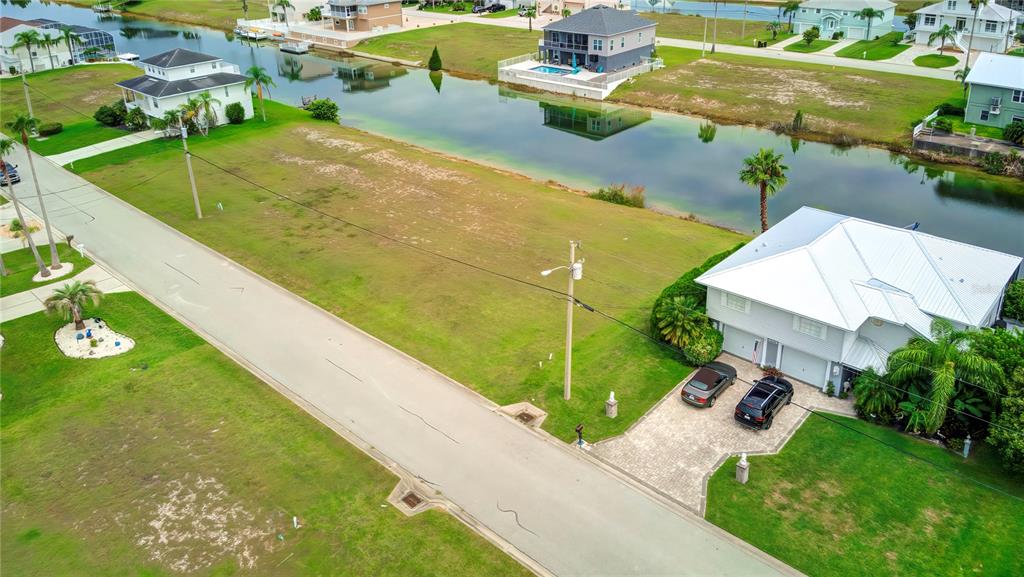 3487 Croaker Drive Hernando Beach, FL 34607 - Photo 2 of 23 a view of a swimming pool with a yard