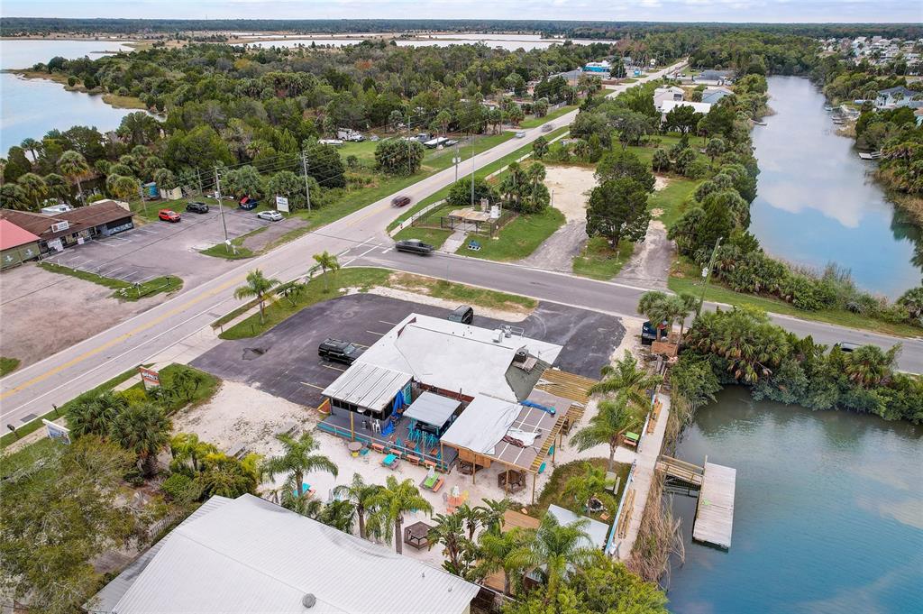 3487 Croaker Drive Hernando Beach, FL 34607 - Photo 23 of 23 an aerial view of residential houses with outdoor space and lake view