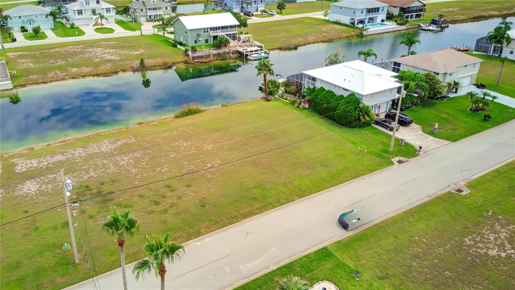 3487 Croaker Drive Hernando Beach, FL 34607 - Photo 8 of 23 a view of a house with a yard