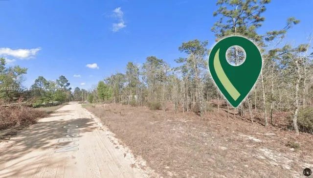 a view of a backyard of a house