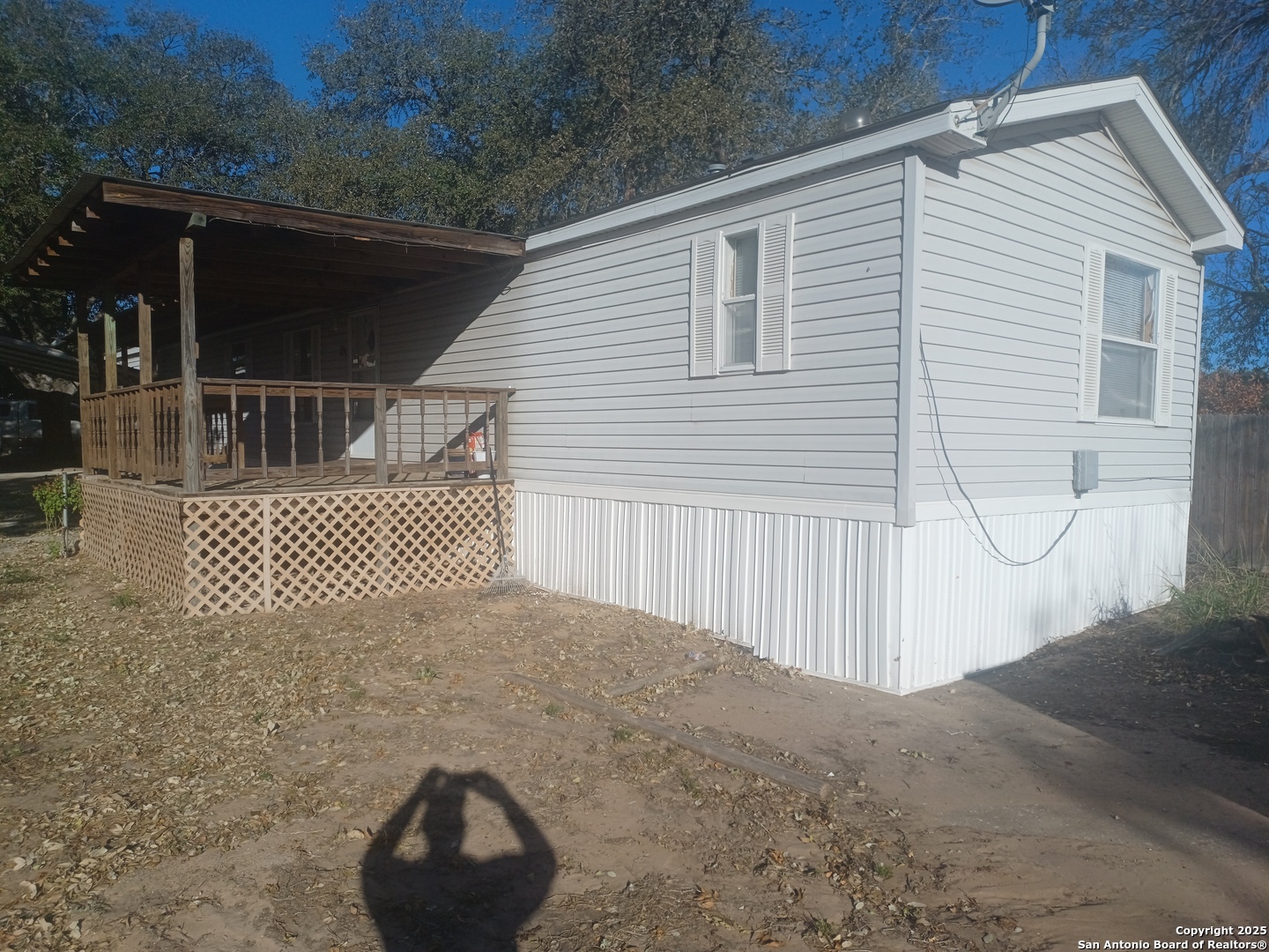 400 Dr Pleasanton, TX 78064 - Photo 13 of 14 a front view of a house with a garage