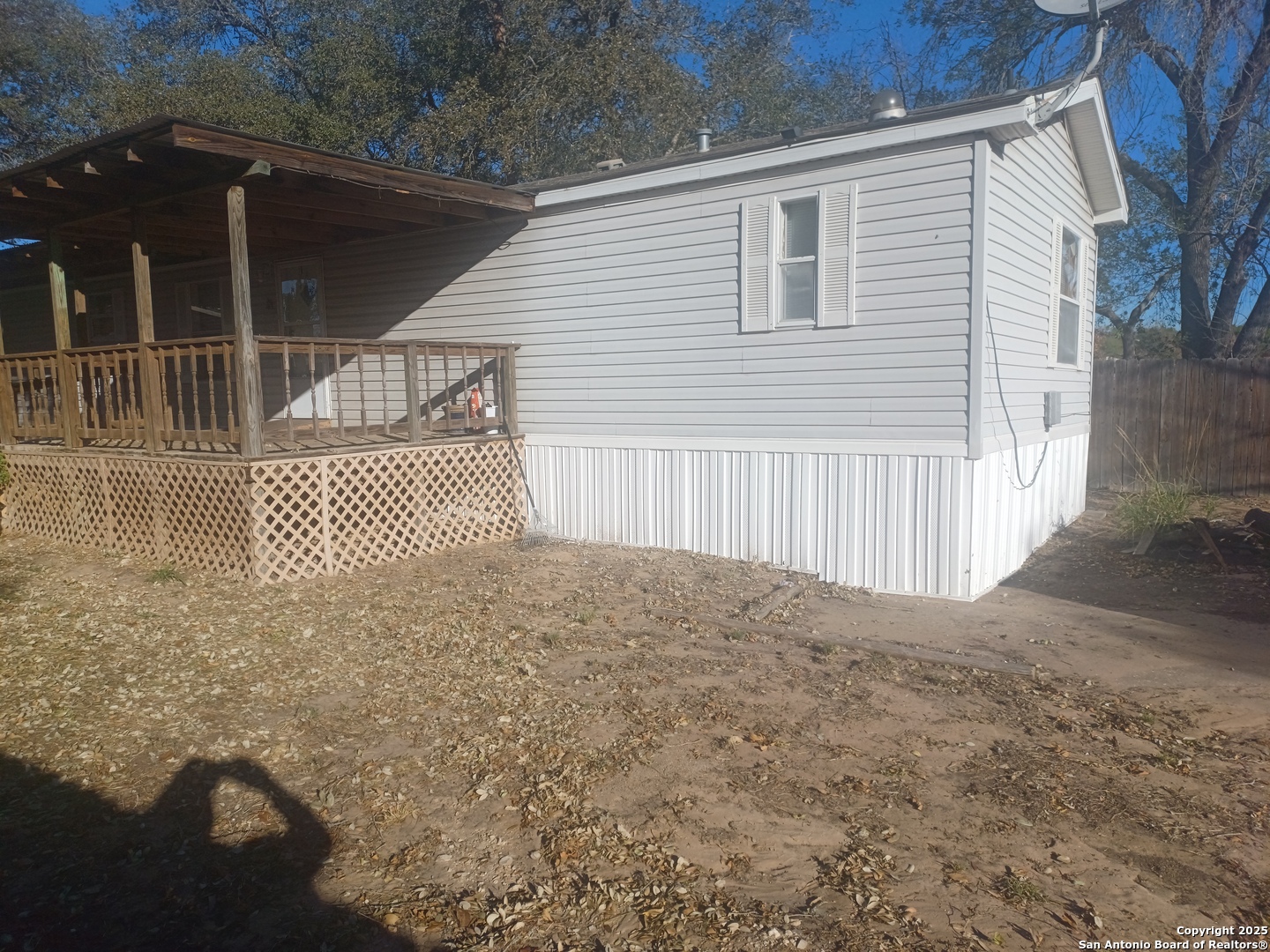 400 Dr Pleasanton, TX 78064 - Photo 14 of 14 a view of a house with a backyard and floor to ceiling window