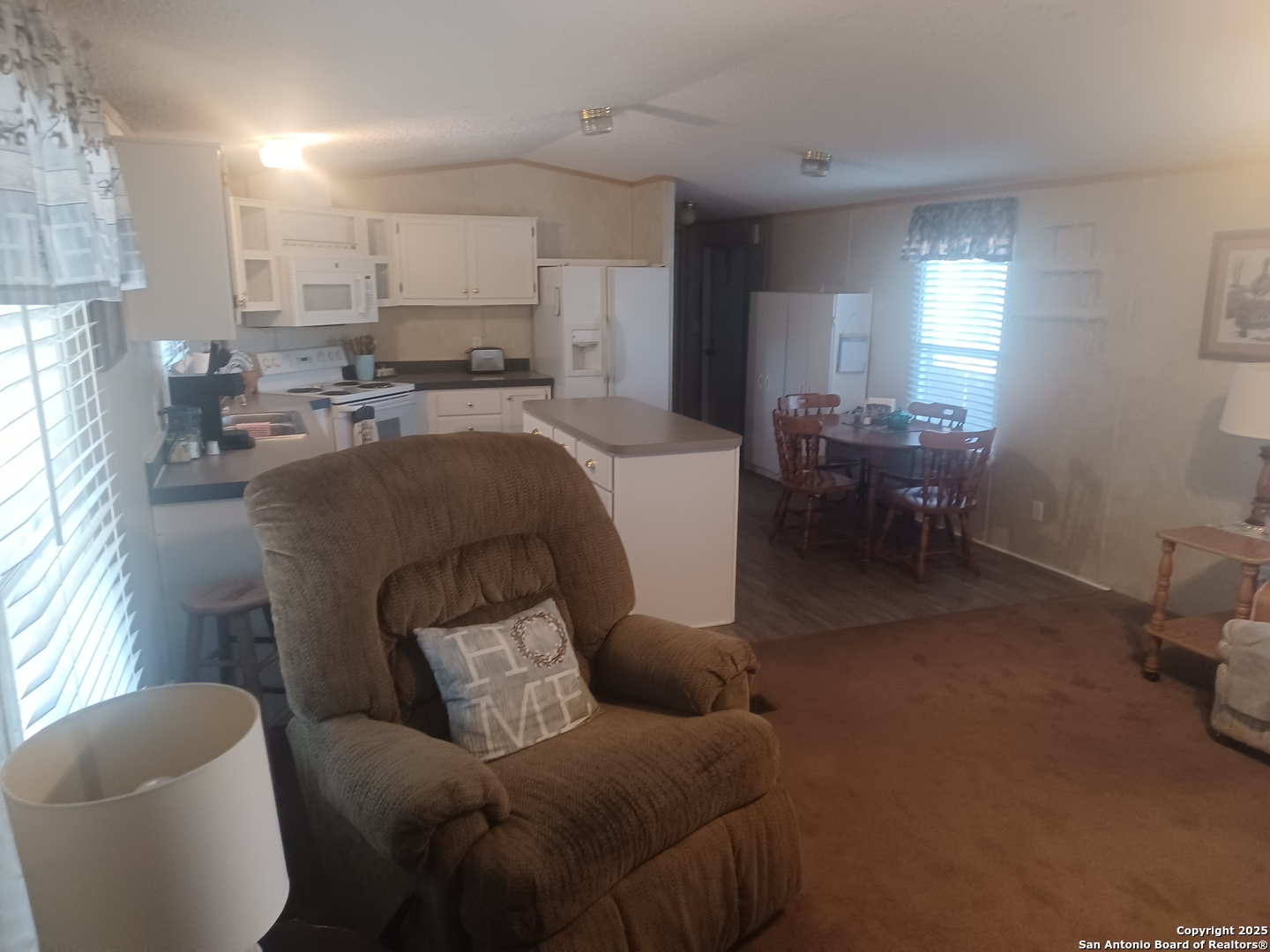 400 Dr Pleasanton, TX 78064 - Photo 3 of 14 a living room with furniture and a window