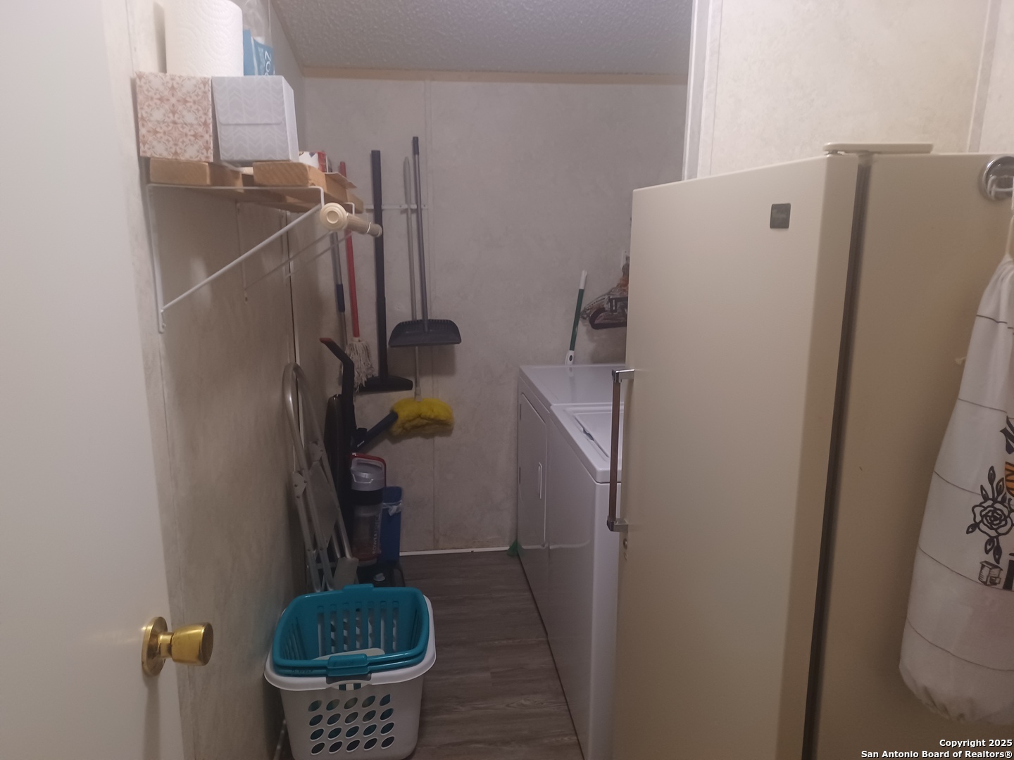 400 Dr Pleasanton, TX 78064 - Photo 5 of 14 a view of storage and utility room with a washer dryer