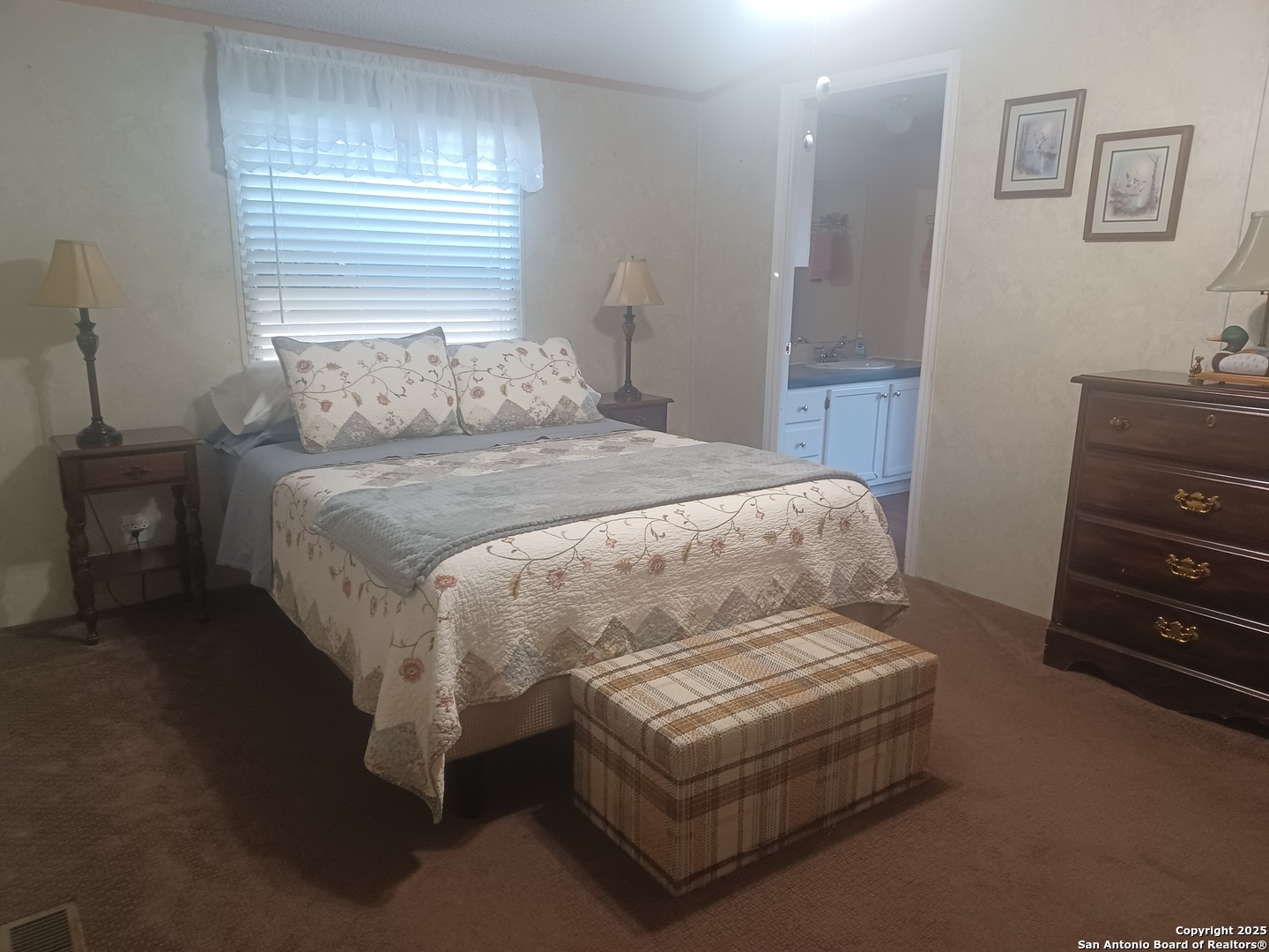 400 Dr Pleasanton, TX 78064 - Photo 6 of 14 a bedroom with a bed and dresser