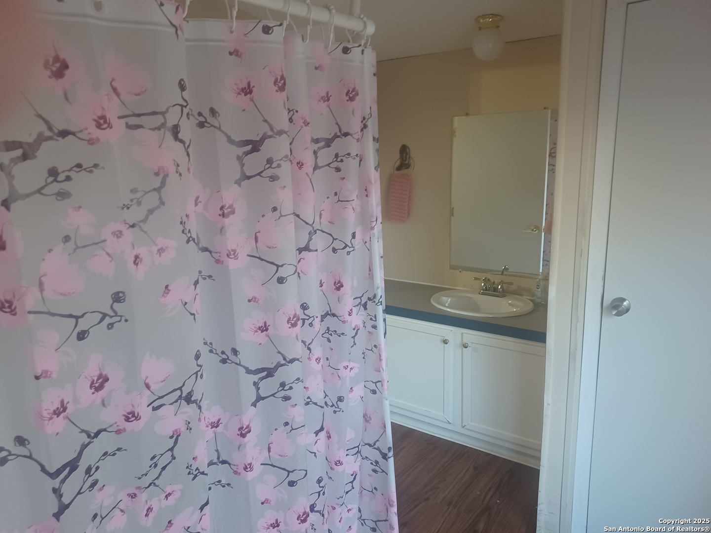 400 Dr Pleasanton, TX 78064 - Photo 7 of 14 a bathroom with a granite countertop sink and a granite