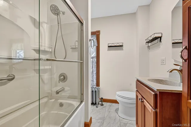 a bathroom with a sink a toilet and a bathtub