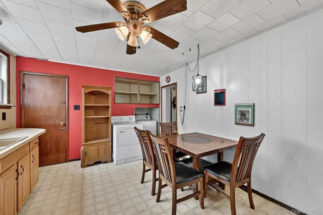 a dining room with furniture and window