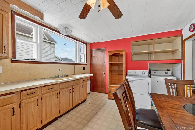 a kitchen that has a lot of cabinets in it