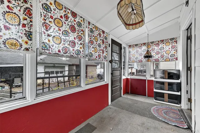 a view of room with window and furniture