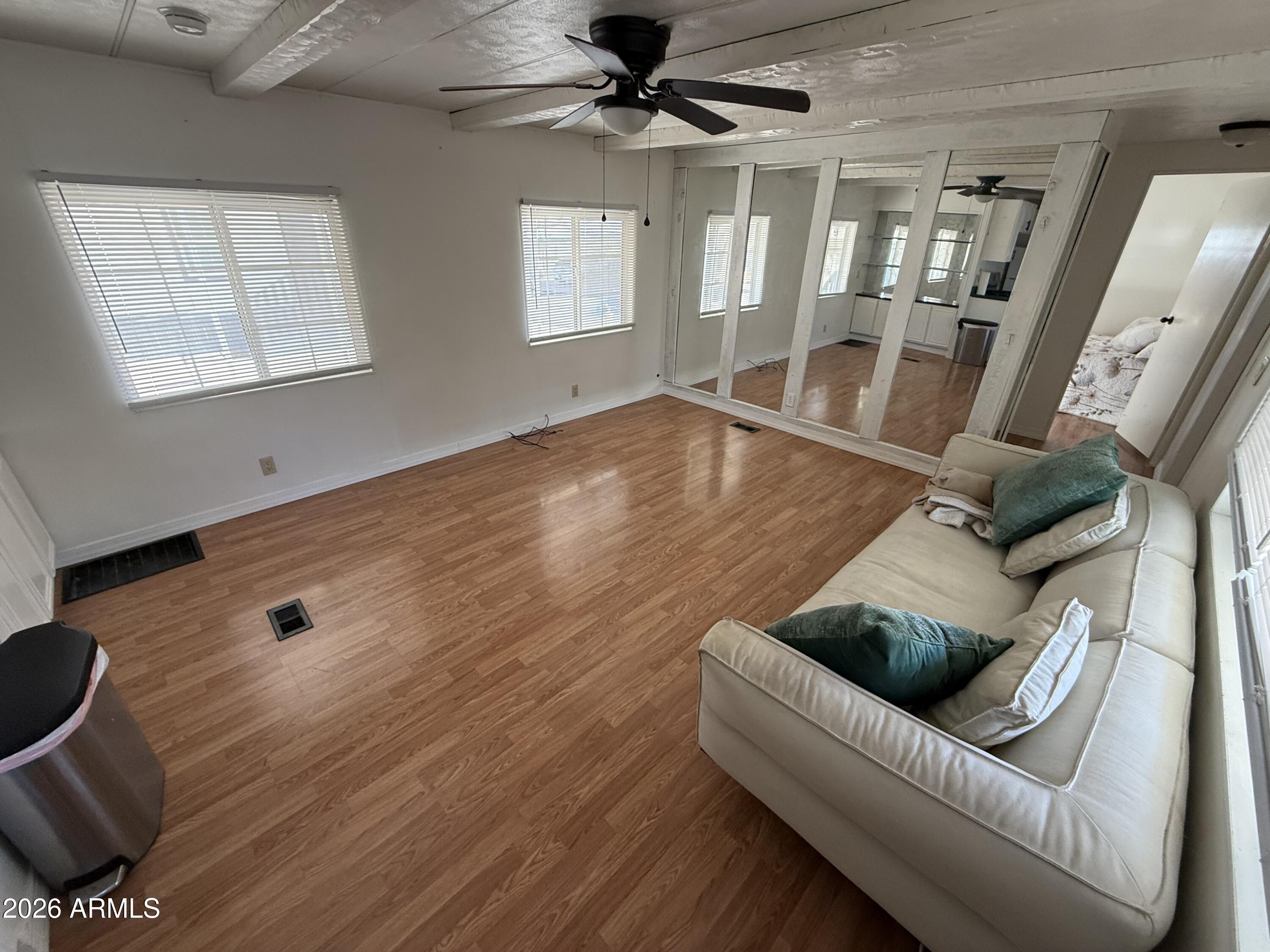 9501 East Broadway Road, Unit 48 Mesa, AZ 85208 - Photo 2 of 12 a living room with furniture and a large window