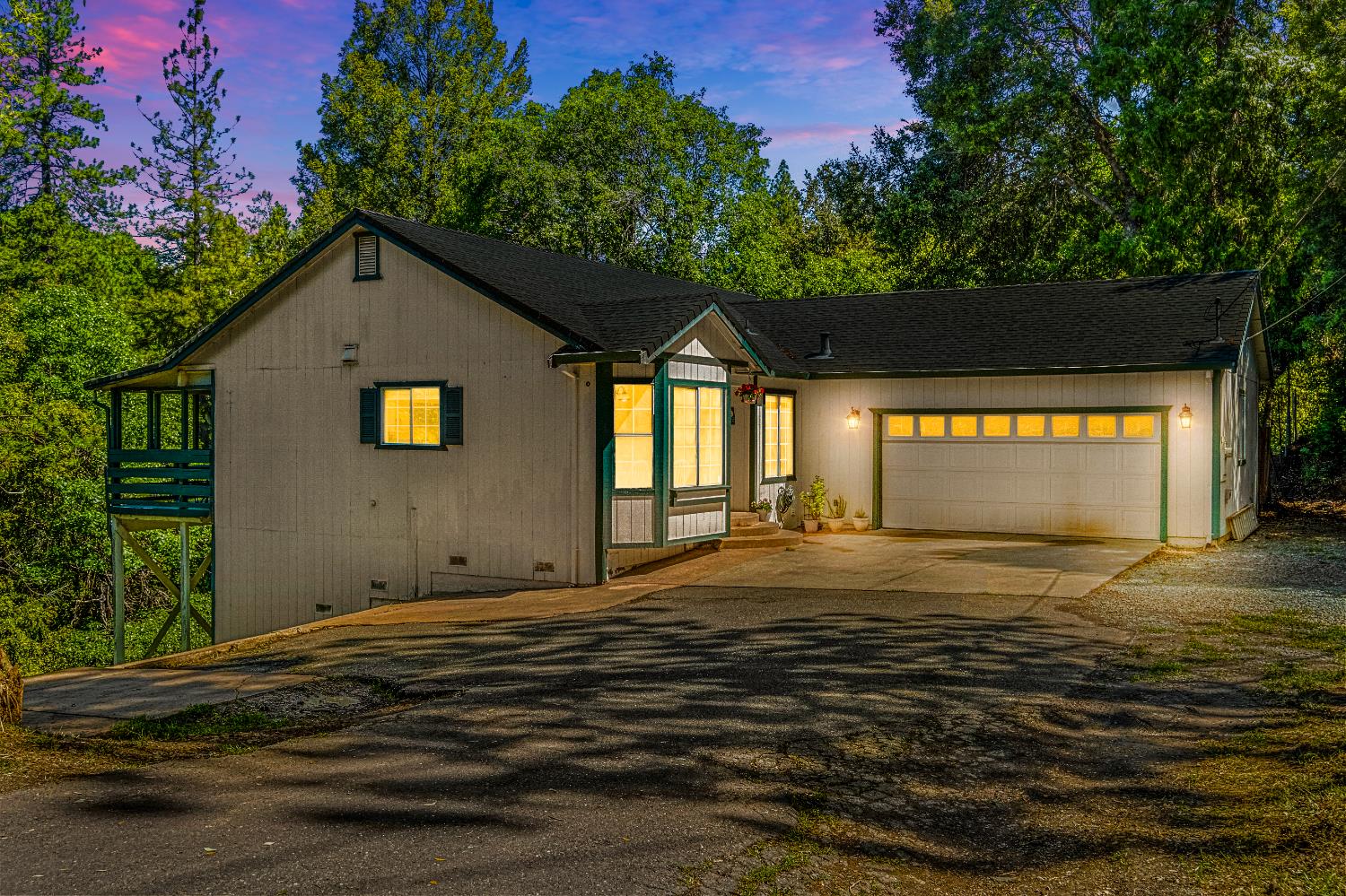 Gorgeous Single Story 1327 Sq. ft home with an attached 2 car garage on 1.9 beautifully treed acreage.