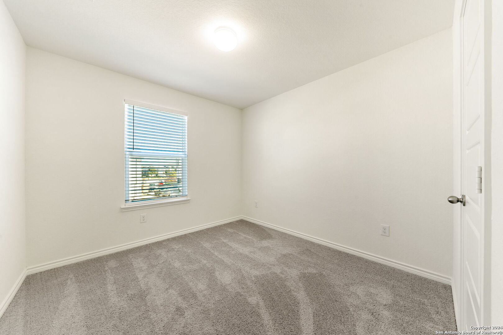 14839 Vance Jackson Road, Unit 910 San Antonio, TX 78249 - Photo 24 of 29 an empty room with a window