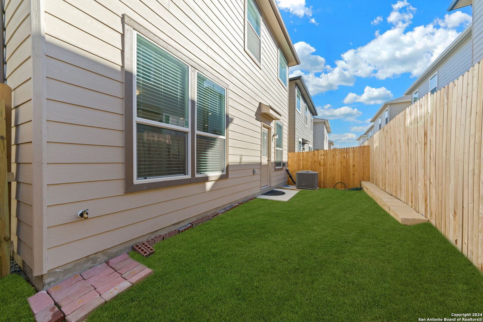 14839 Vance Jackson Road, Unit 910 San Antonio, TX 78249 - Photo 28 of 29 a view of backyard with a garden and entertaining space