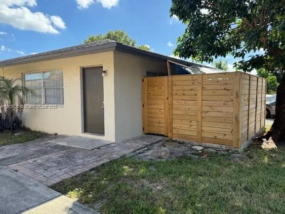a view of a house with a backyard