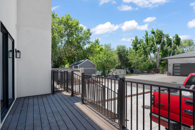7238 South 525 East Midvale, UT 84047 - Photo 26 of 29 Spacious outdoor deck with composite decking and black metal railing