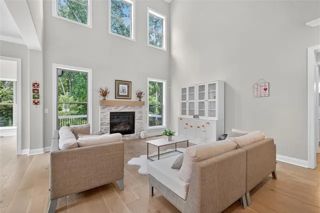 a living room with furniture and a chandelier