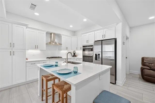 an aerial view of residential houses with outdoor space and swimming pool