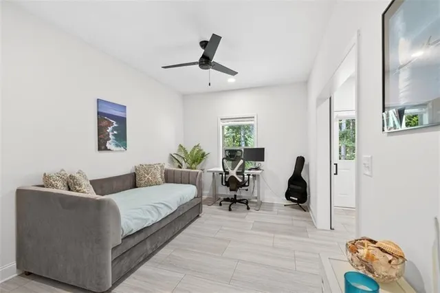 an aerial view of a house with a garden and lake view