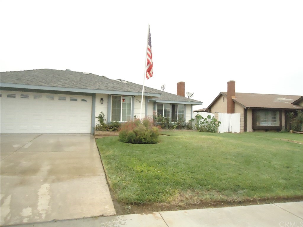 7290 Idyllwild Lane Riverside, CA 92503 - Photo 1 of 1 a front view of a house with a garden