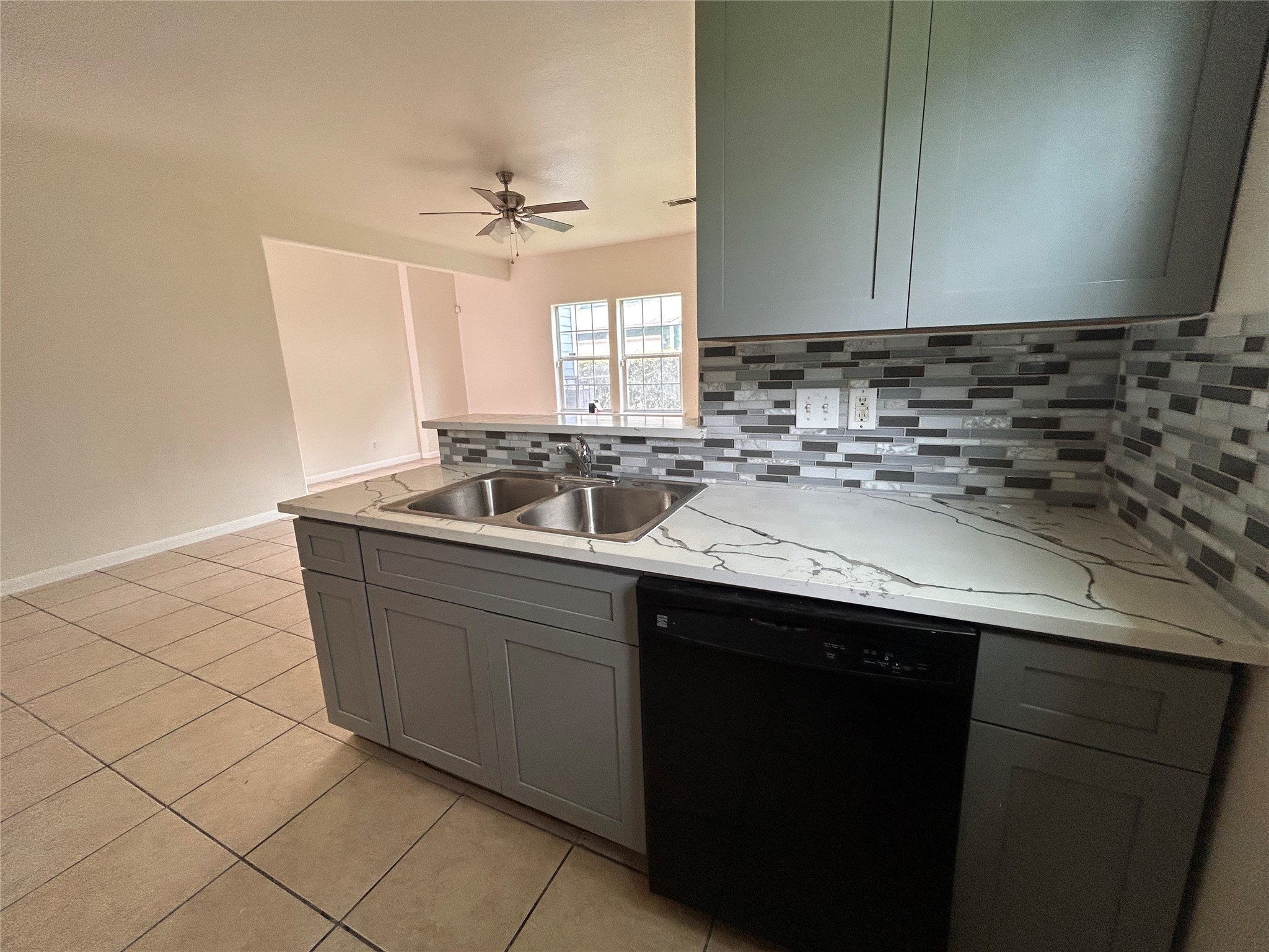 6841 Larkstone Street, Unit B Houston, TX 77028 - Photo 10 of 11 a kitchen with a sink and cabinets