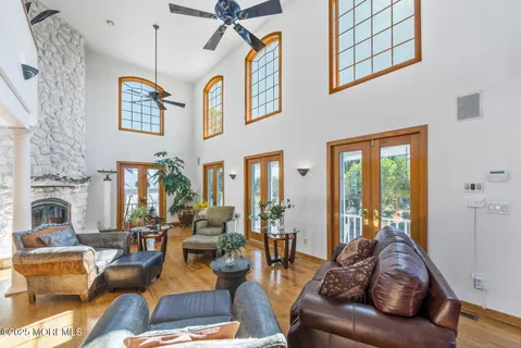 a view of a hallway with a ceiling fan