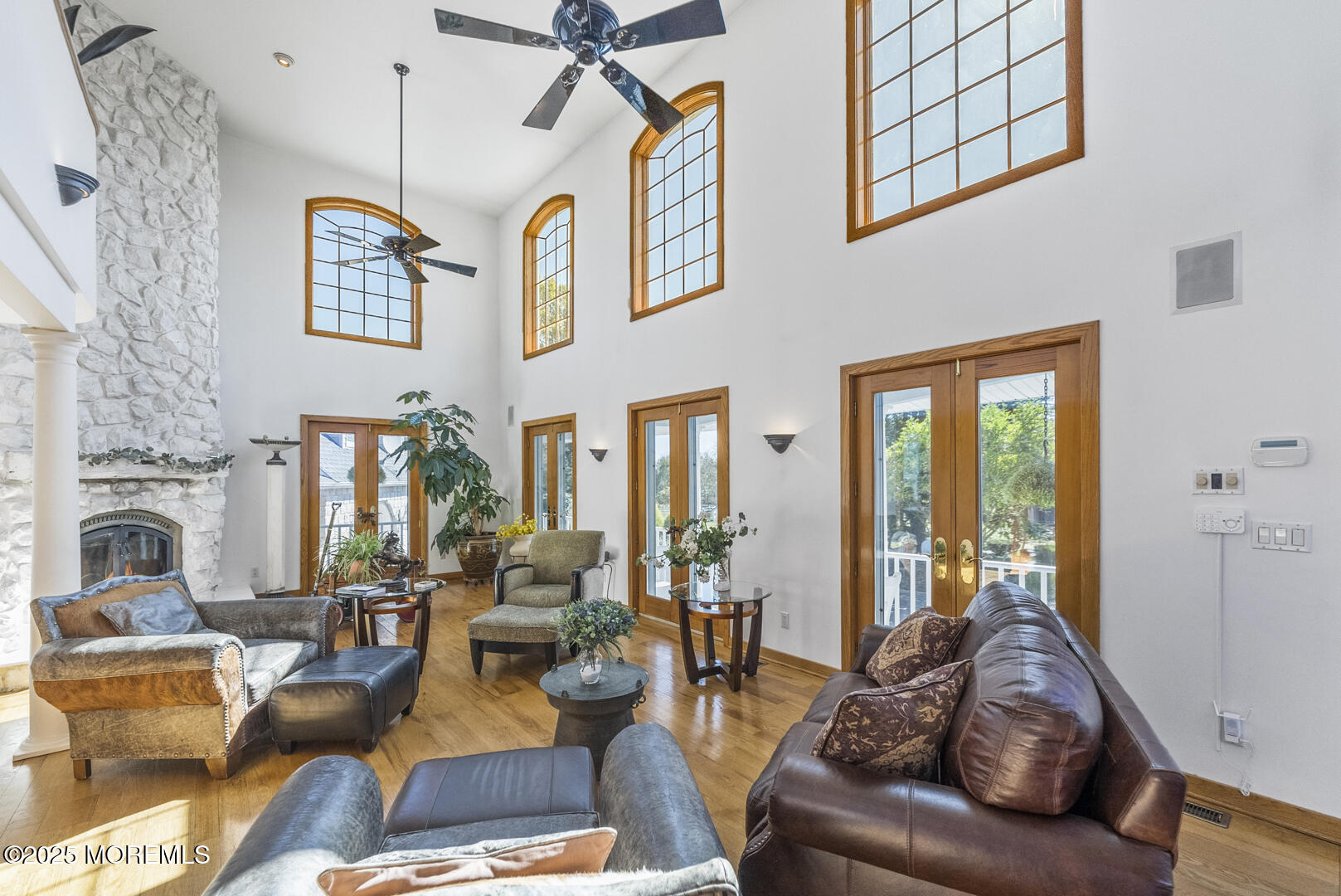 18 Schoolhouse Road Cream Ridge, NJ 08514 - Photo 15 of 136 a living room with furniture fireplace and a chandelier