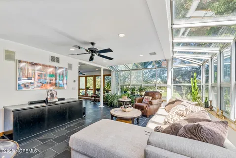 a dining room with furniture and window
