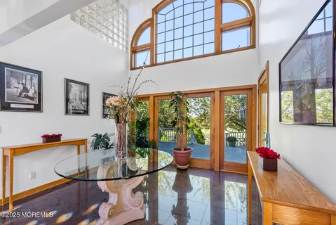 a bedroom with a bed wooden floor and a fireplace