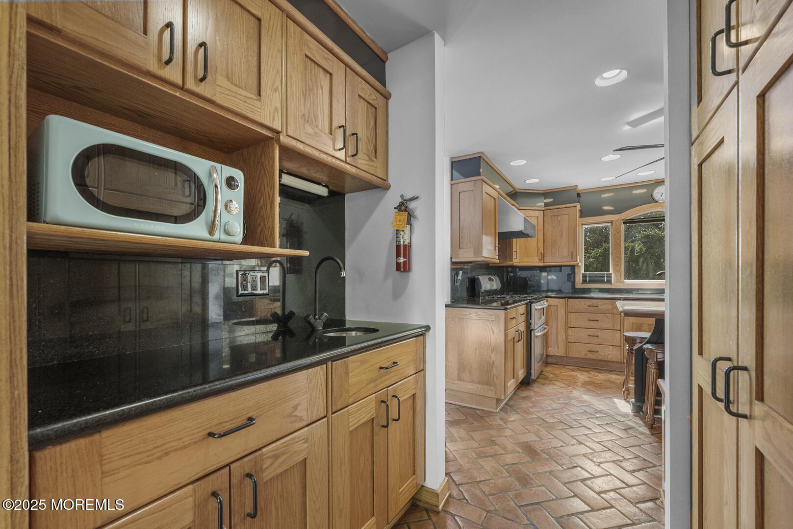 18 Schoolhouse Road Cream Ridge, NJ 08514 - Photo 29 of 136 a kitchen with stainless steel appliances granite countertop a stove and a microwave