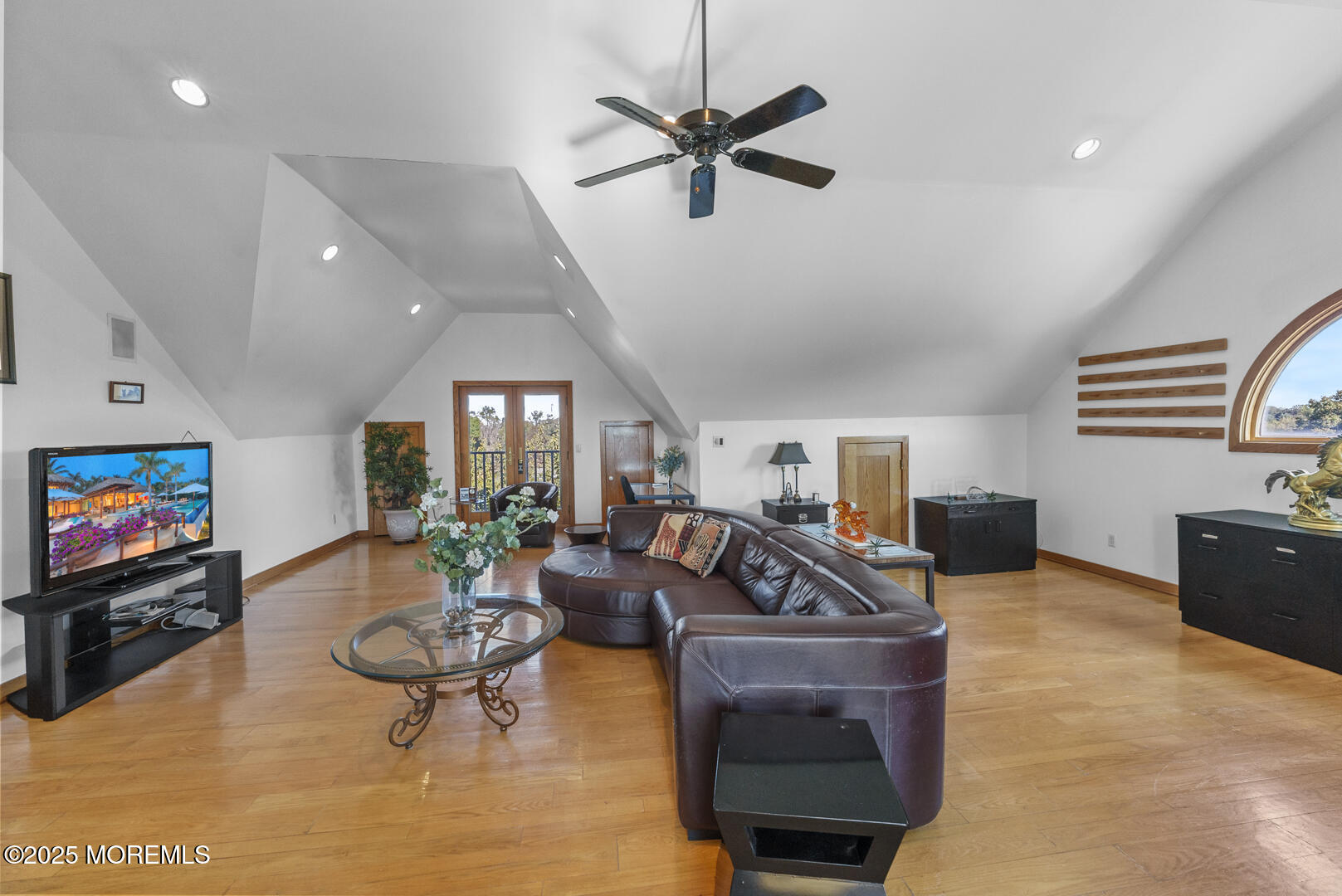 18 Schoolhouse Road Cream Ridge, NJ 08514 - Photo 61 of 136 a living room with furniture a rug and a flat screen tv