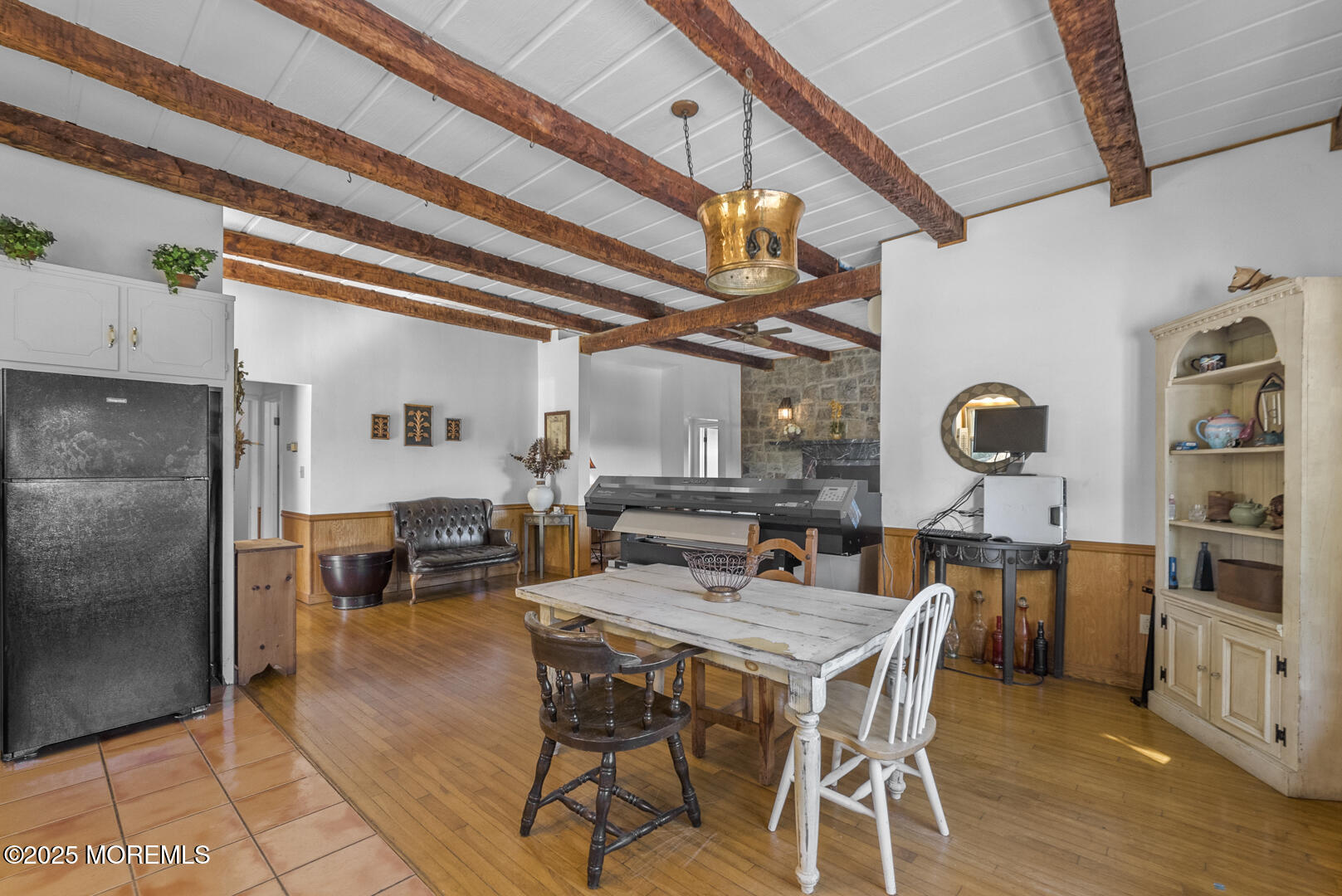 18 Schoolhouse Road Cream Ridge, NJ 08514 - Photo 74 of 136 a view of a dining room with furniture and a chandelier