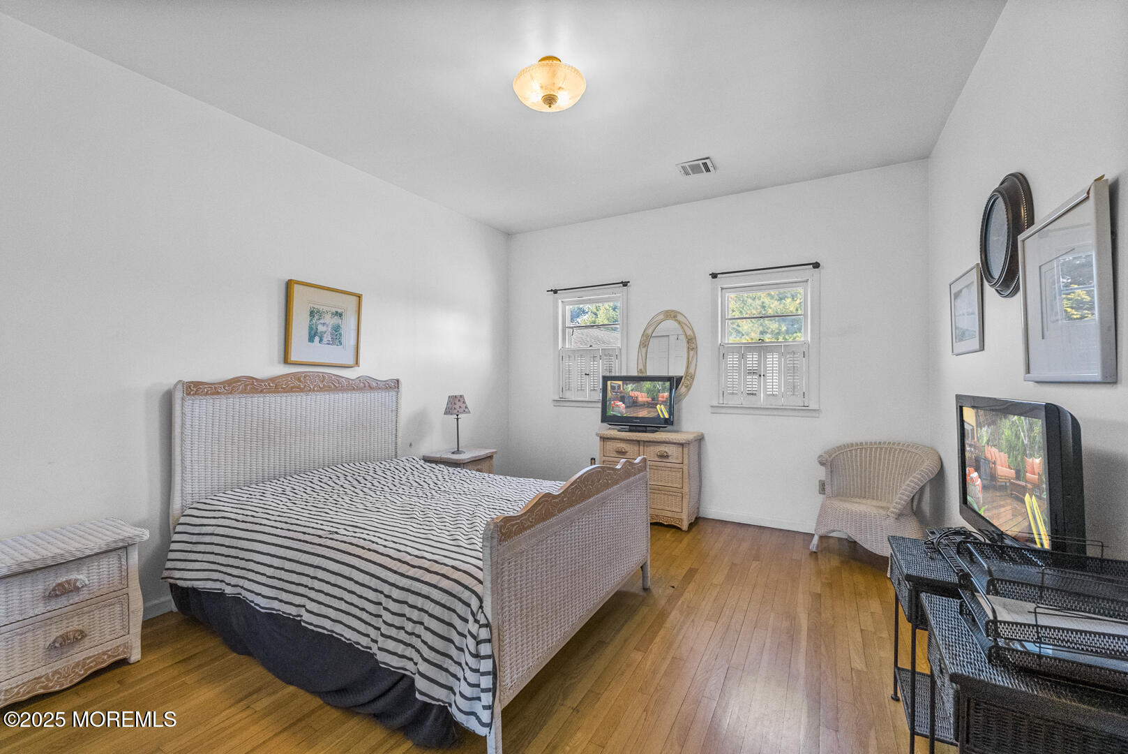 18 Schoolhouse Road Cream Ridge, NJ 08514 - Photo 81 of 136 a bedroom with a bed and wooden floor