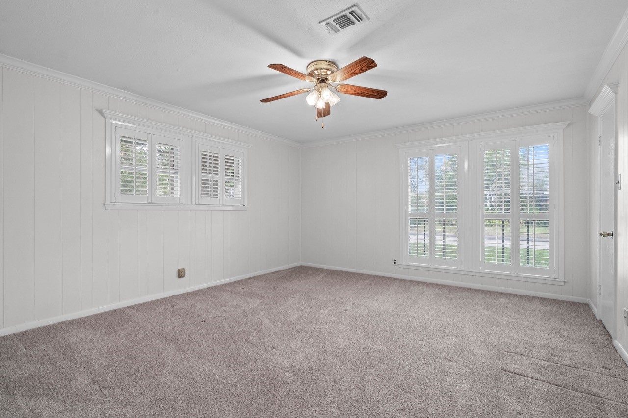 702 3rd Street Humble, TX 77338 - Photo 41 of 44 Bedroom #2 overlooks the front yard and the side yard. This room is also adorned with plantation shutters. Plenty of room to add big sized furniture.