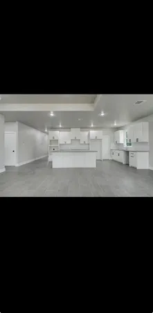 a view of cabinets with a black and white kitchen