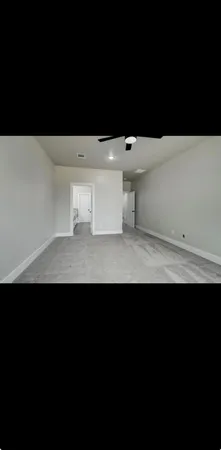 a view of a room with a black and white wall