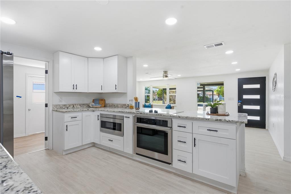 613 Highview Circle North Brandon, FL 33510 - Photo 16 of 37 a kitchen with white cabinets stainless steel appliances and sink