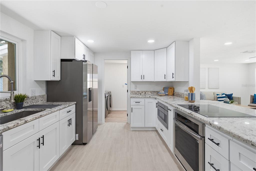 613 Highview Circle North Brandon, FL 33510 - Photo 17 of 37 a kitchen with a sink stove and refrigerator
